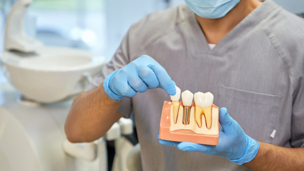 Implant dentist consulting with a patient about dental implant treatment